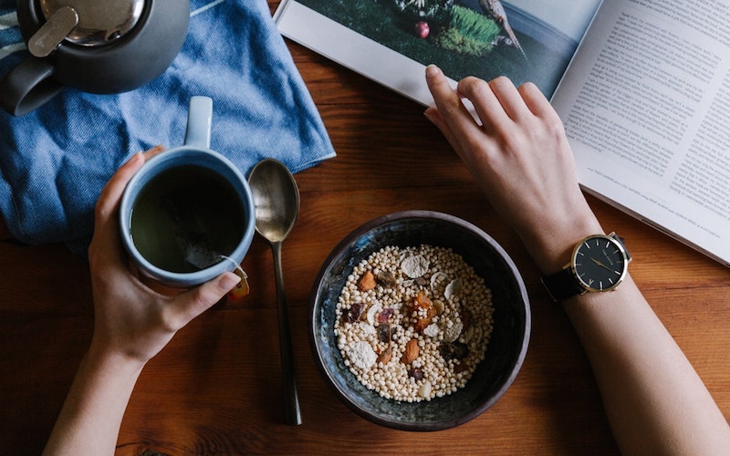 Muesli, hot drink and a book