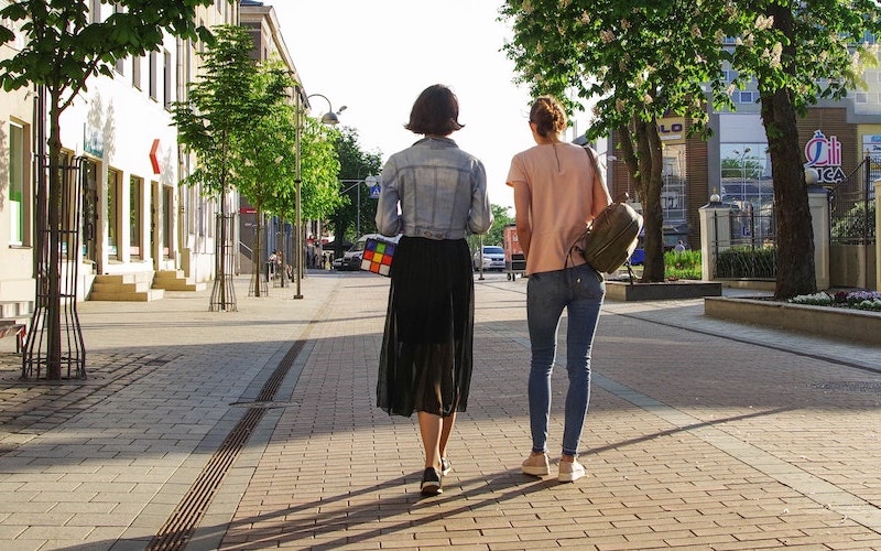 women-walking-outside