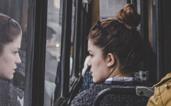 Woman sitting on public transport