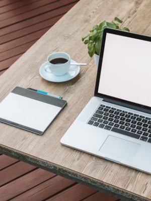 Laptop Cup and Saucer on Table