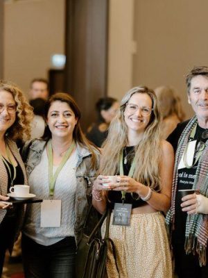 Delegates at LM23 smiling at the camera