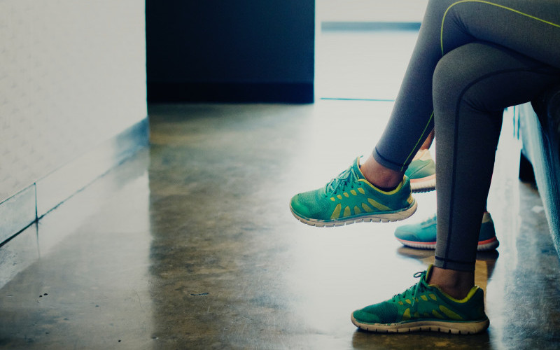 Lady wearing runners in waiting room